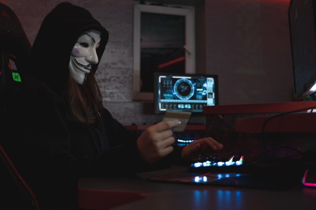 zipwp-image-5380665 Woman in Black Hoodie Holding a Bank Card